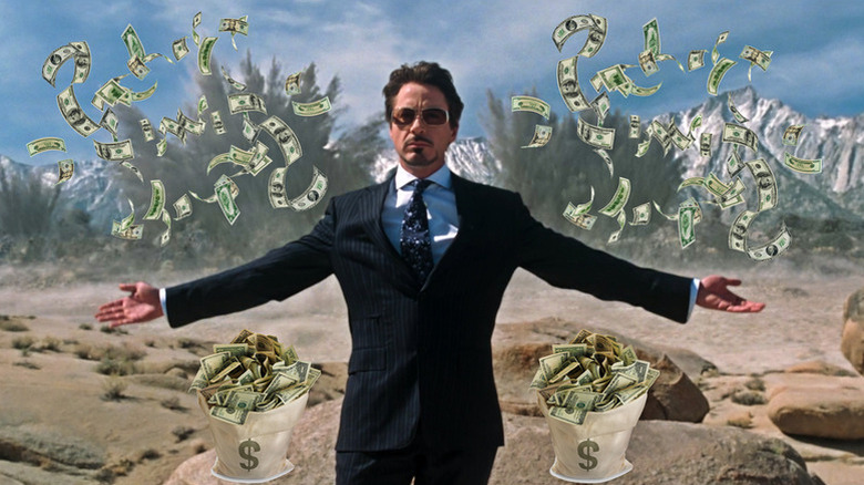 Tony Stark (Robert Downey Jr.) presents the Jericho in Iron Man featuring dollars raining down
