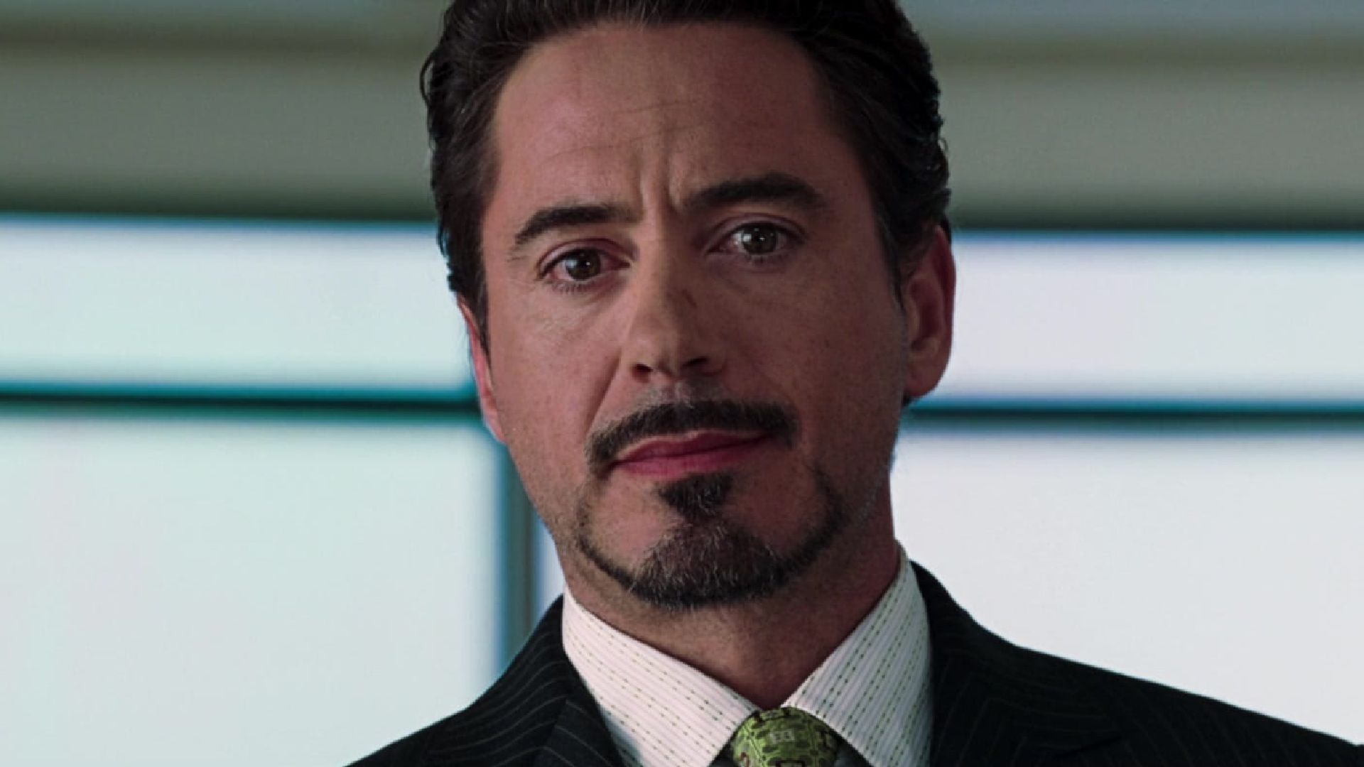 Tony Stark smirks after revealing that he is Iron Man in Iron Man 2008