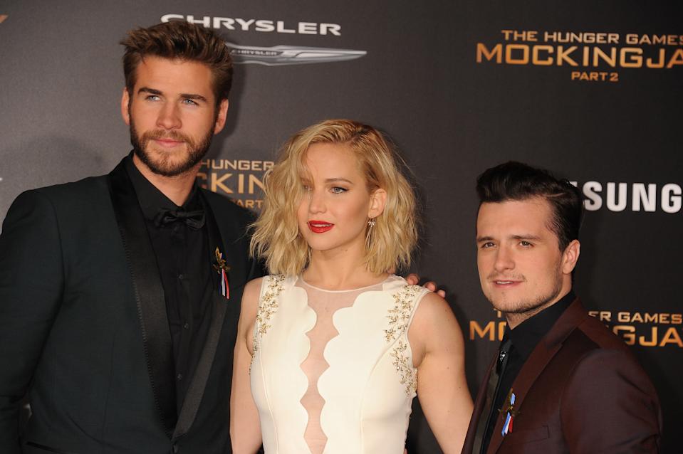 (L-R) Actors Liam Hemsworth, Jennifer Lawrence and Josh Hutcherson arrive at the premiere of "The Hunger Games: Mockingjay - Part 2"